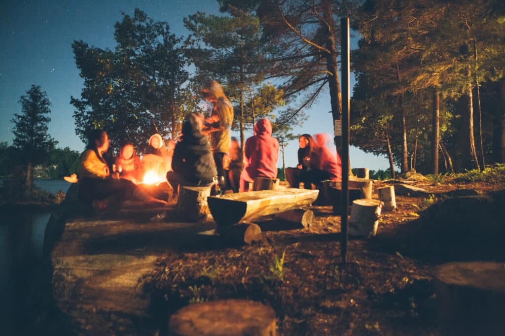Camping by the fire in Quebec - Tegan Mierle Unsplash