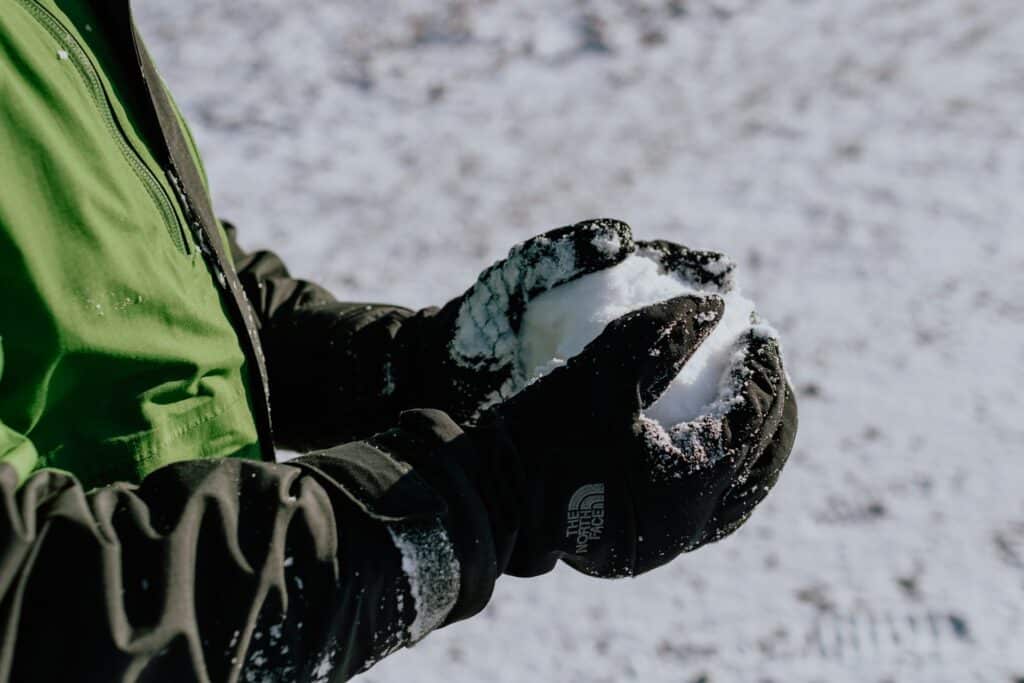 A Person Who Makes a Snow Ball - with his Mittens - Kelly Sikkema - From Unsplash