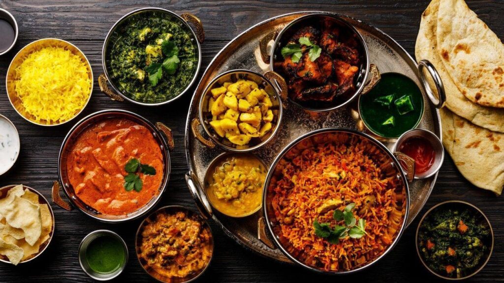 Table With Various Indian Dishes - Chateau de Linde Restaurant