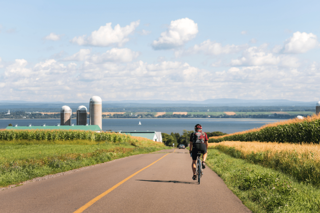 A Man Riding a Road Bike - on Ile dOrleans - Destination Quebec Cite - Jeff-Frenette