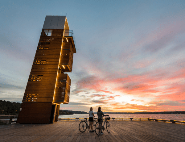Jeff Frenette - Destination Quebec Cite - Two People on a Bike Break - Near a Tower Overlooking the St-Lawrence River