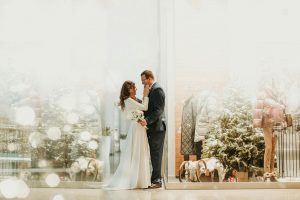 Couple in front of bridal shop