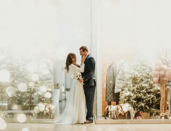 Couple in front of bridal shop