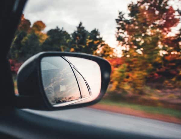 Car mirror on a fall roadtrip - Nathalia Segato - Unsplash