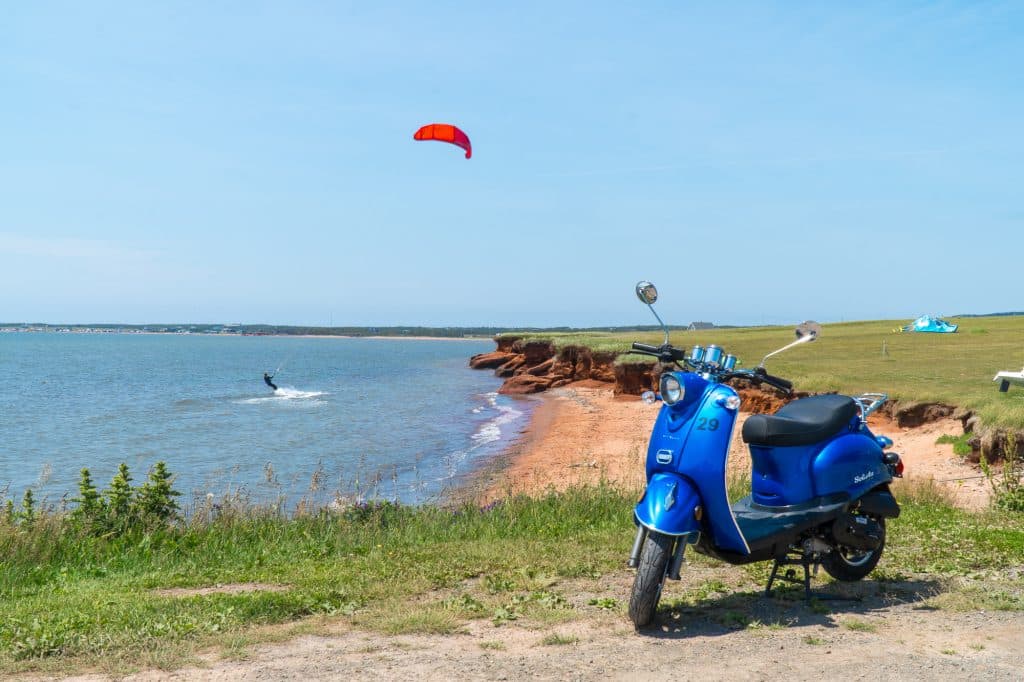 Blue scooter in front of Parc de Gros-Cap beach